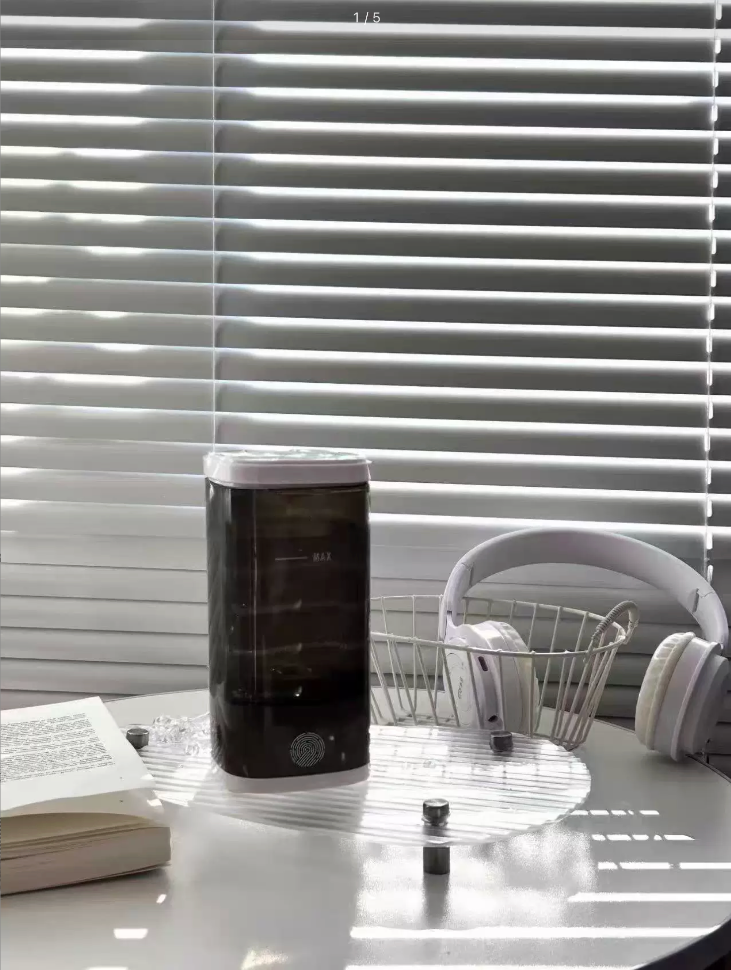 Sample review photo of the black makeup brush cleaner on a vanity