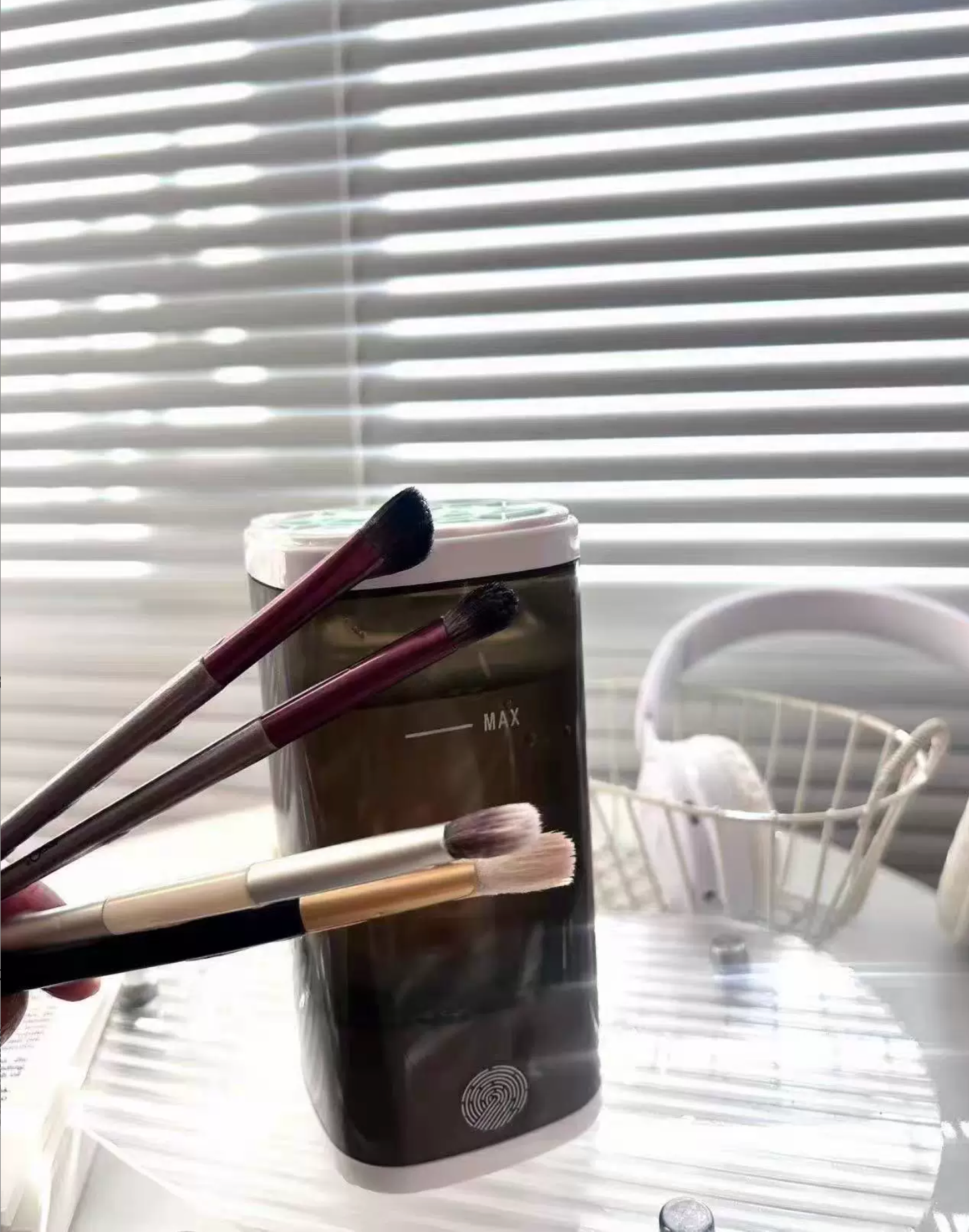 Sample review photo of clean makeup brushes beside the cleaner