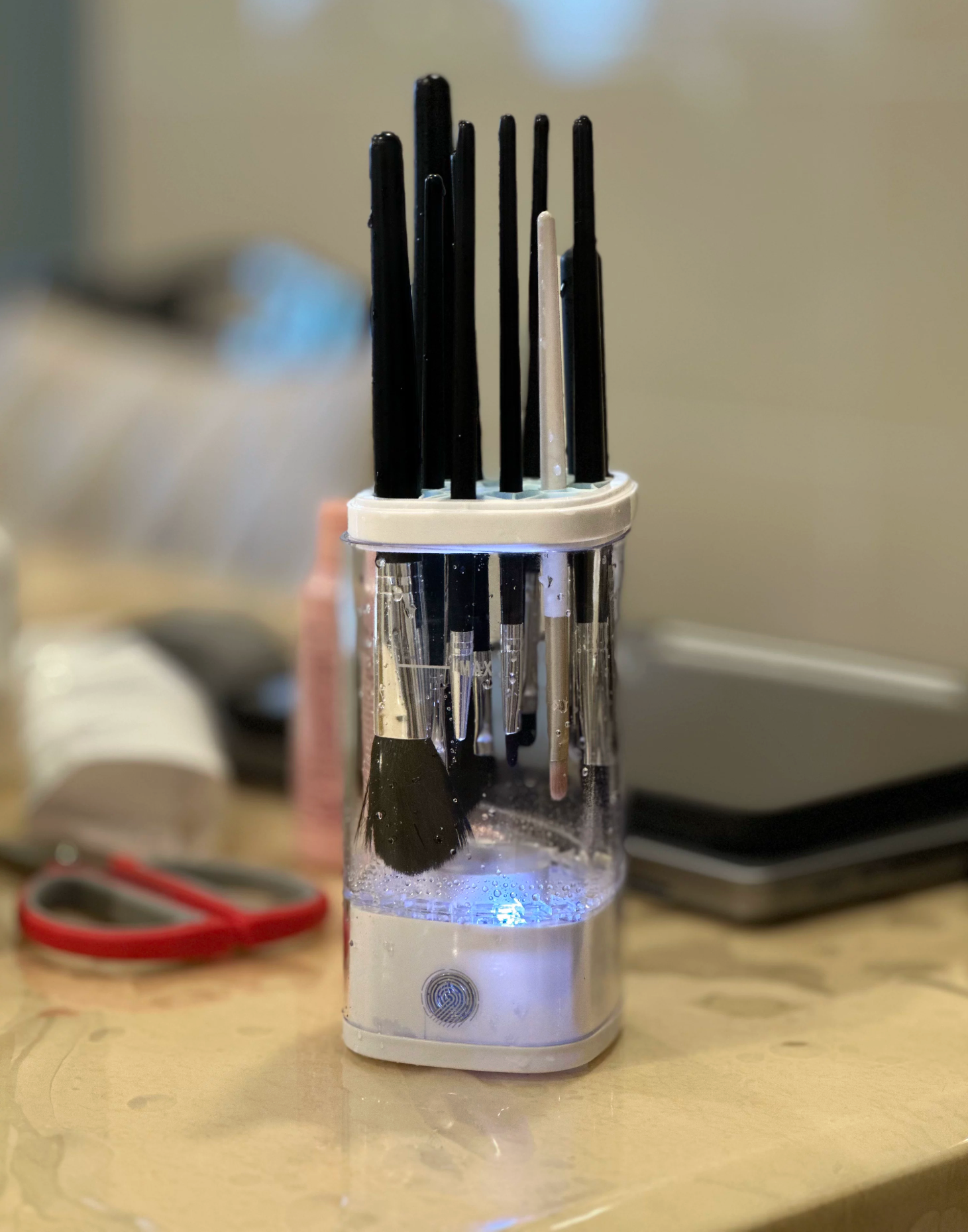 Sample review photo of the white Nuvie brush cleaner in use
